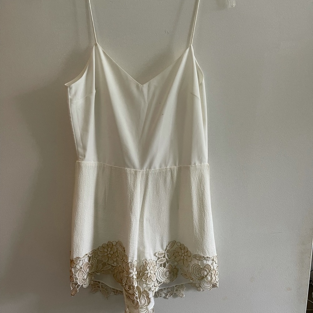 Beautiful white romper with gold lace and cover